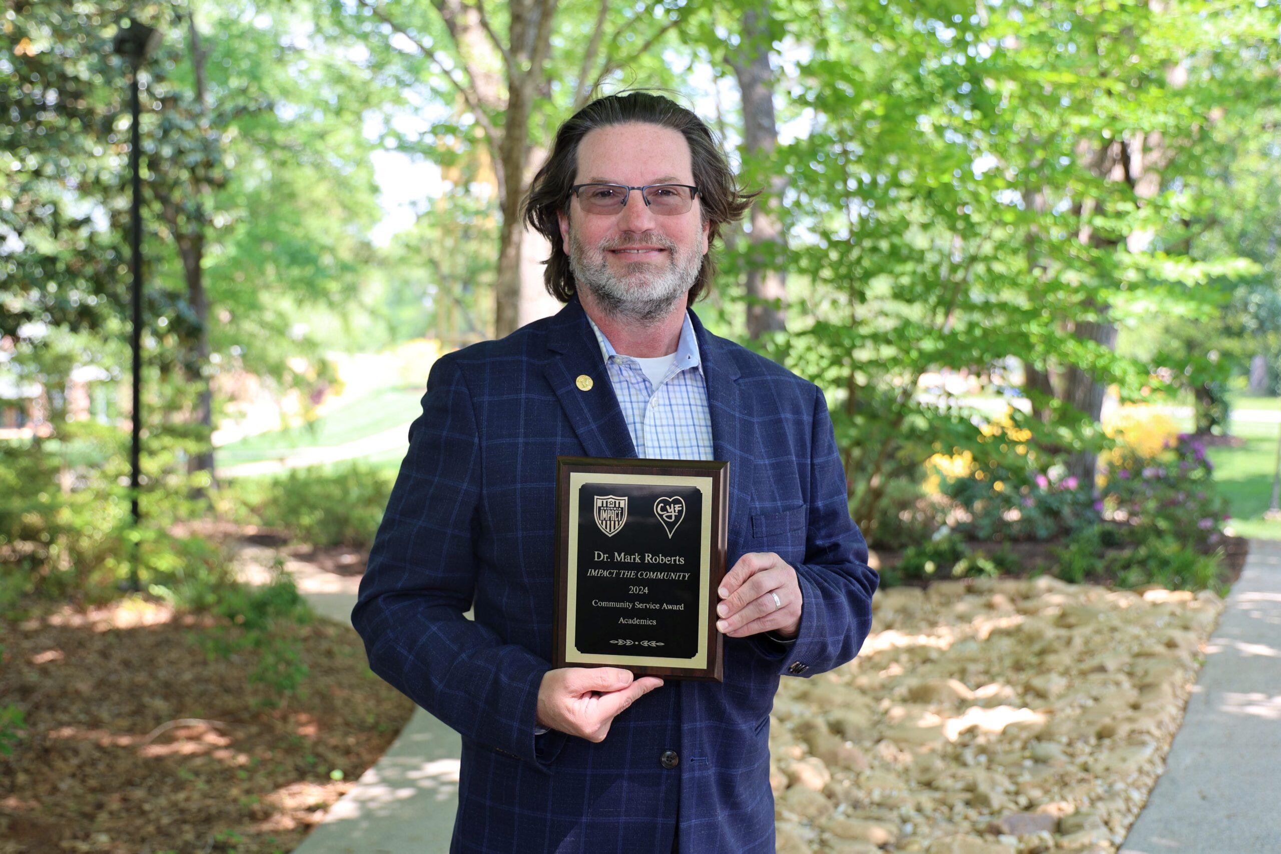 Dr. Roberts Receives the Impact 2024 Community Service Award