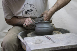Greek artists creates a ceramic vase