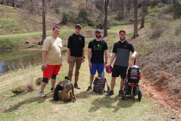 students with golf equipment